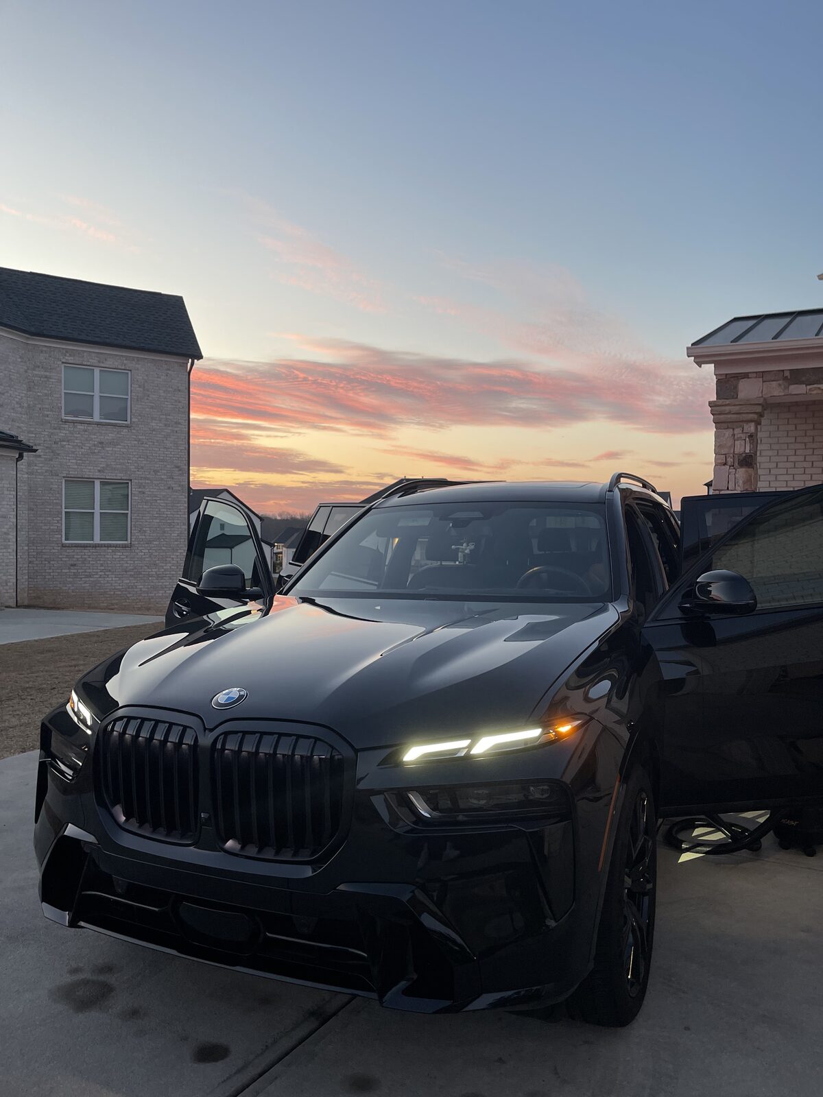 Black BMW exterior detail at sunset
