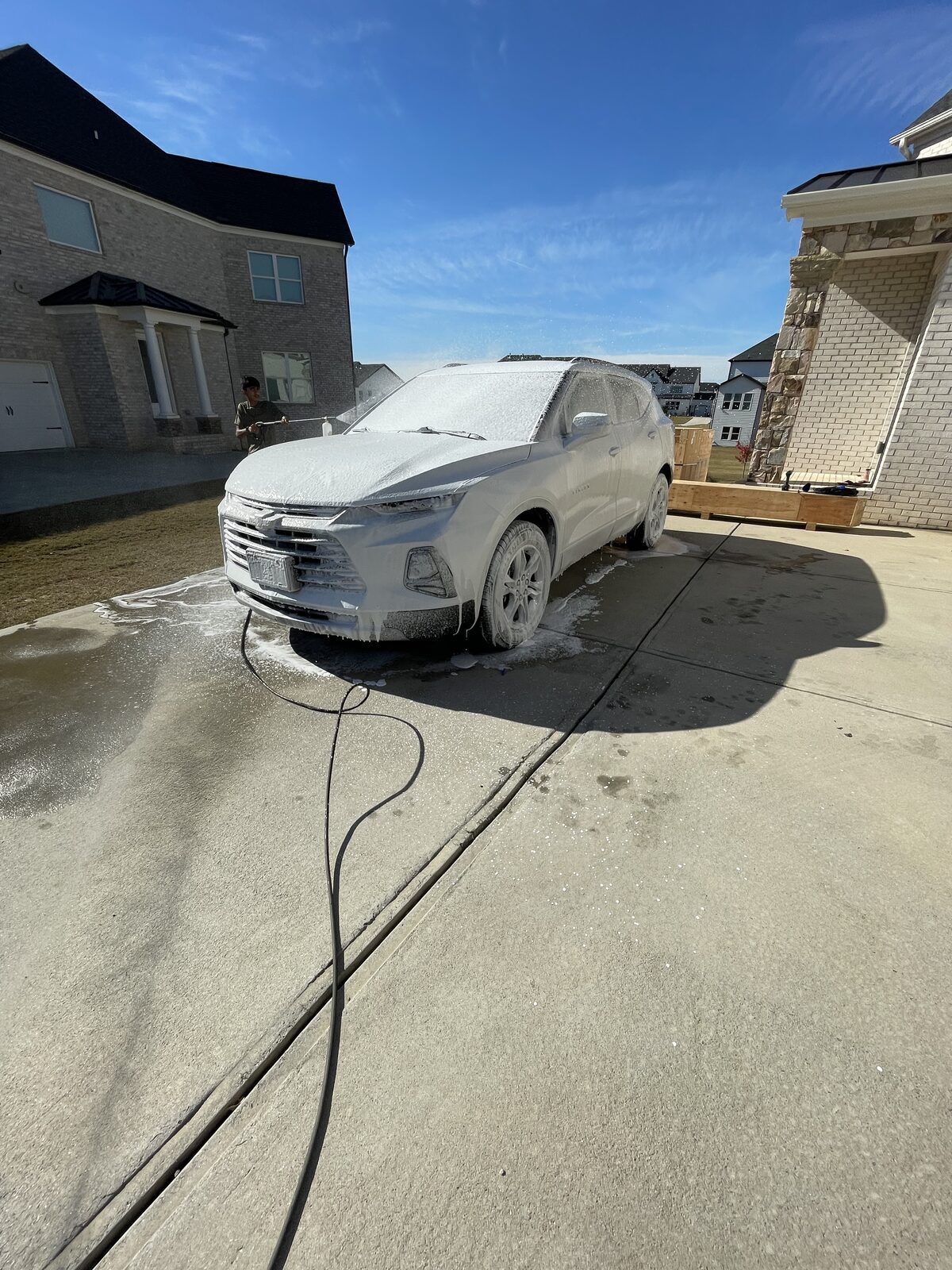 Car being hand washed during onsite detail
